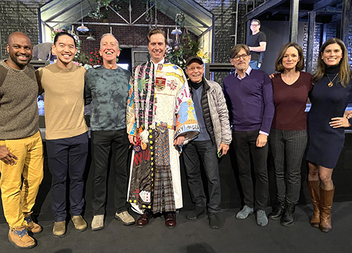 Steven Booth wears the Legacy Robe in the middle of a row of eight people, the rest of whom are previous recipients of the Legacy Robe who attended the ceremony.