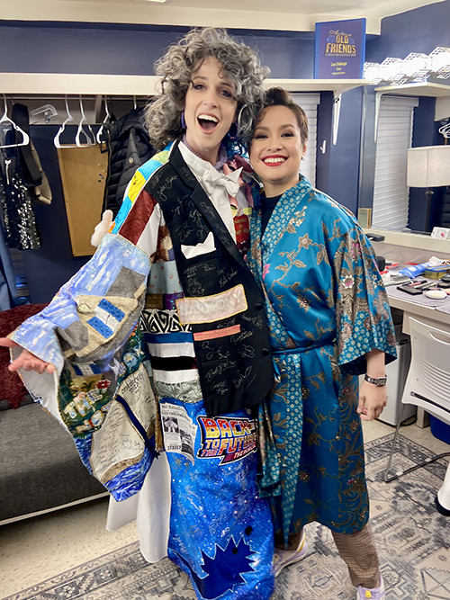 Faure in the Robe and Lea Salonga smile together backstage.